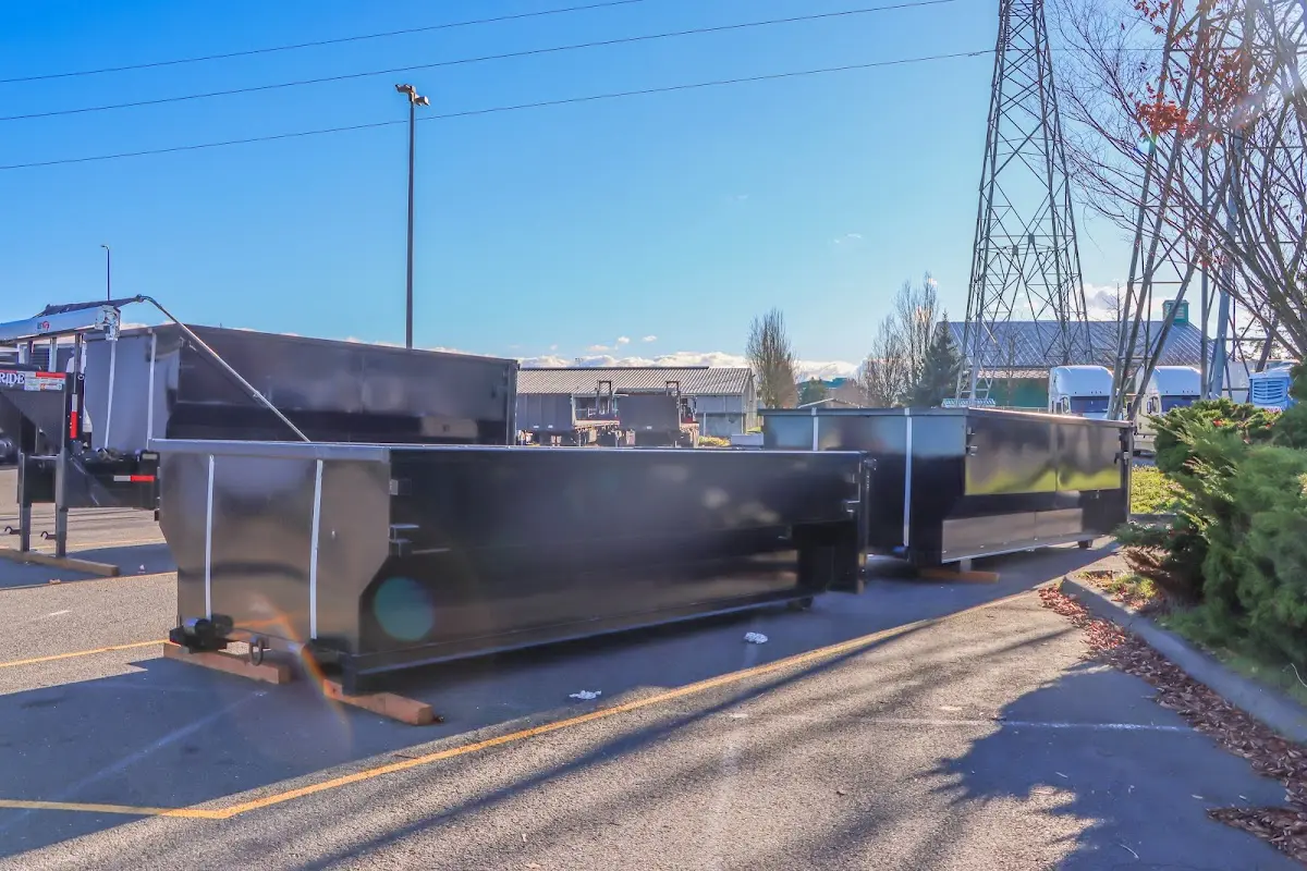 Roll-off dumpster ready for waste disposal at job site for 3 Yard Dumpster Rental in Merced